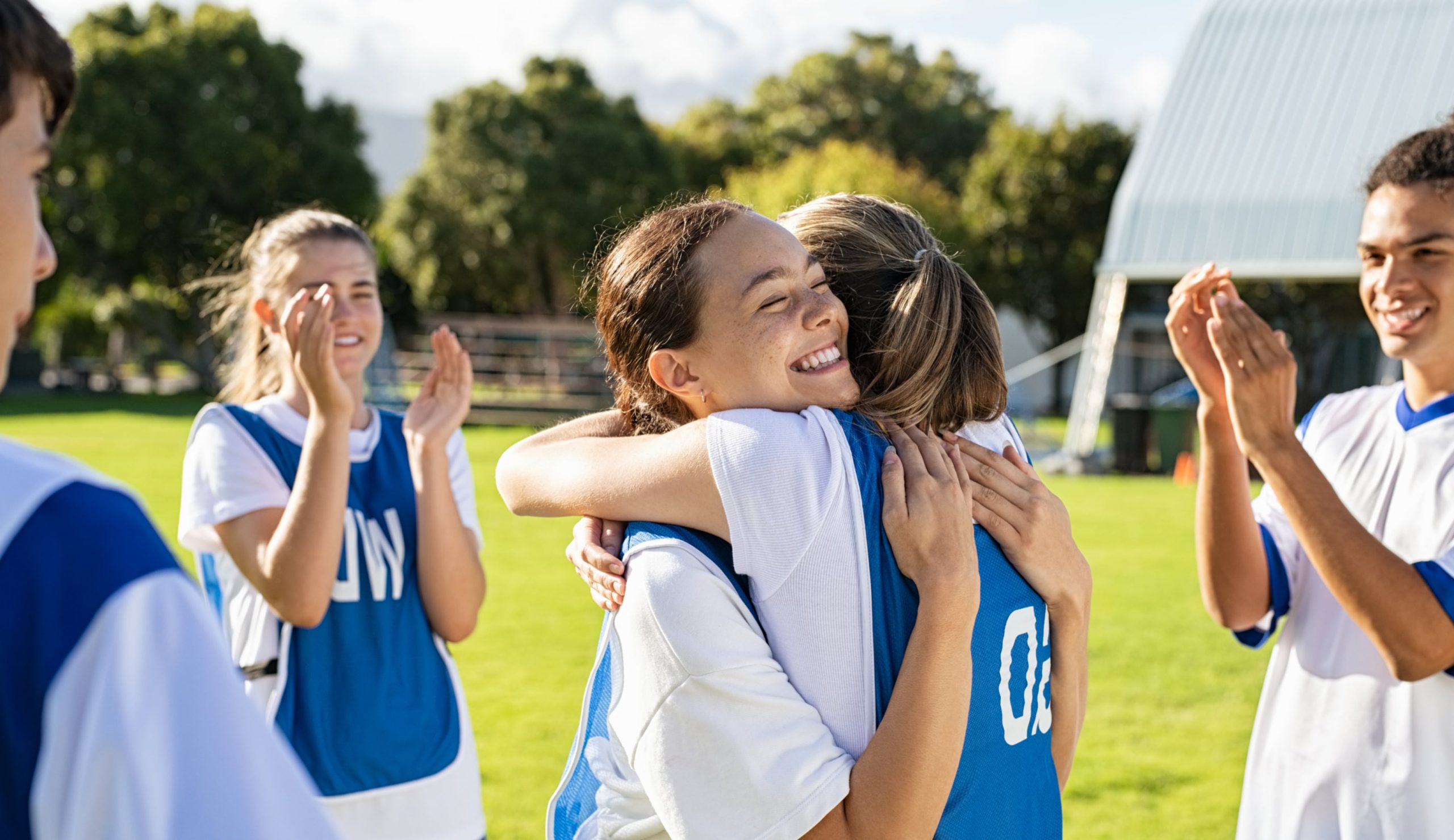 Youth team celebrating happily