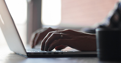 Person typing on a laptop