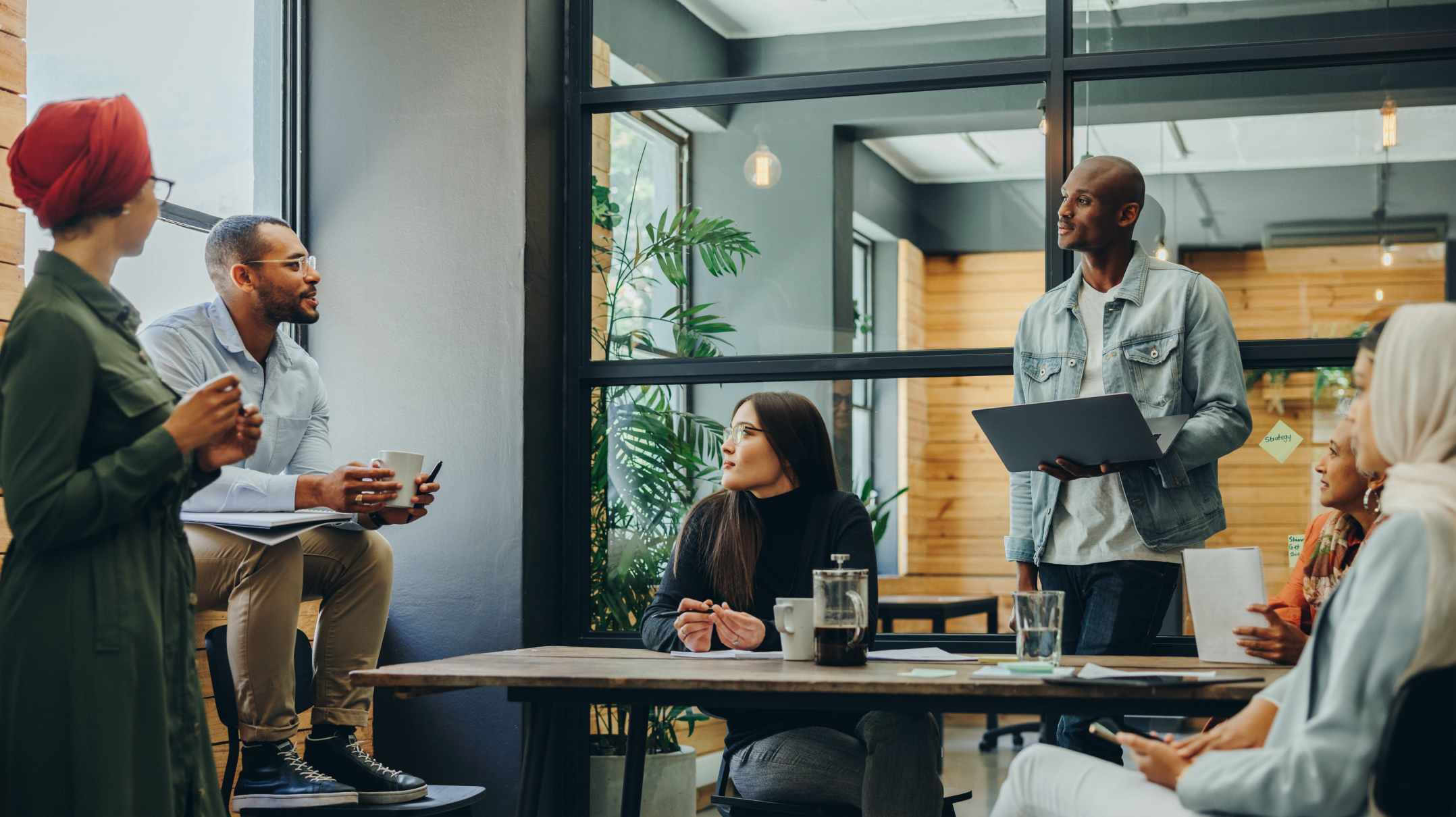 An office team chatting with eachother.