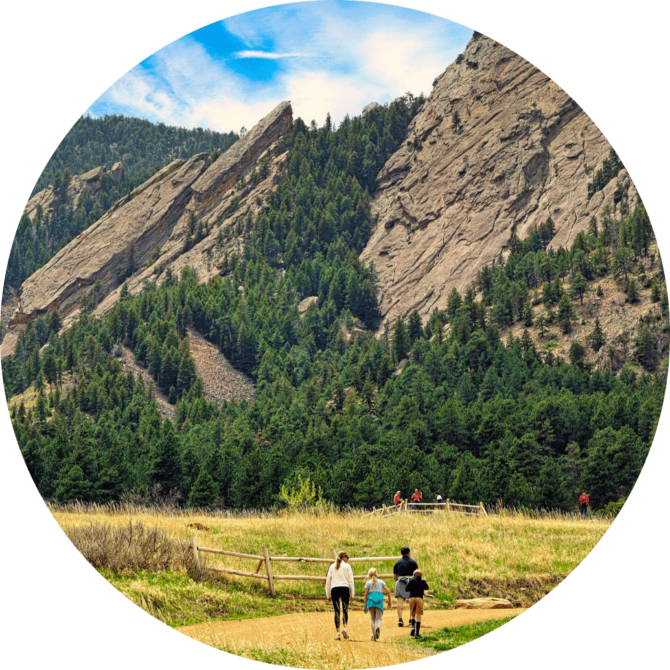 Family going on walk through a mountain trail.