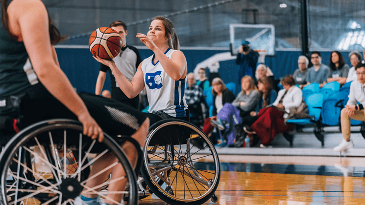 Athlete in a wheelchair playing basketball