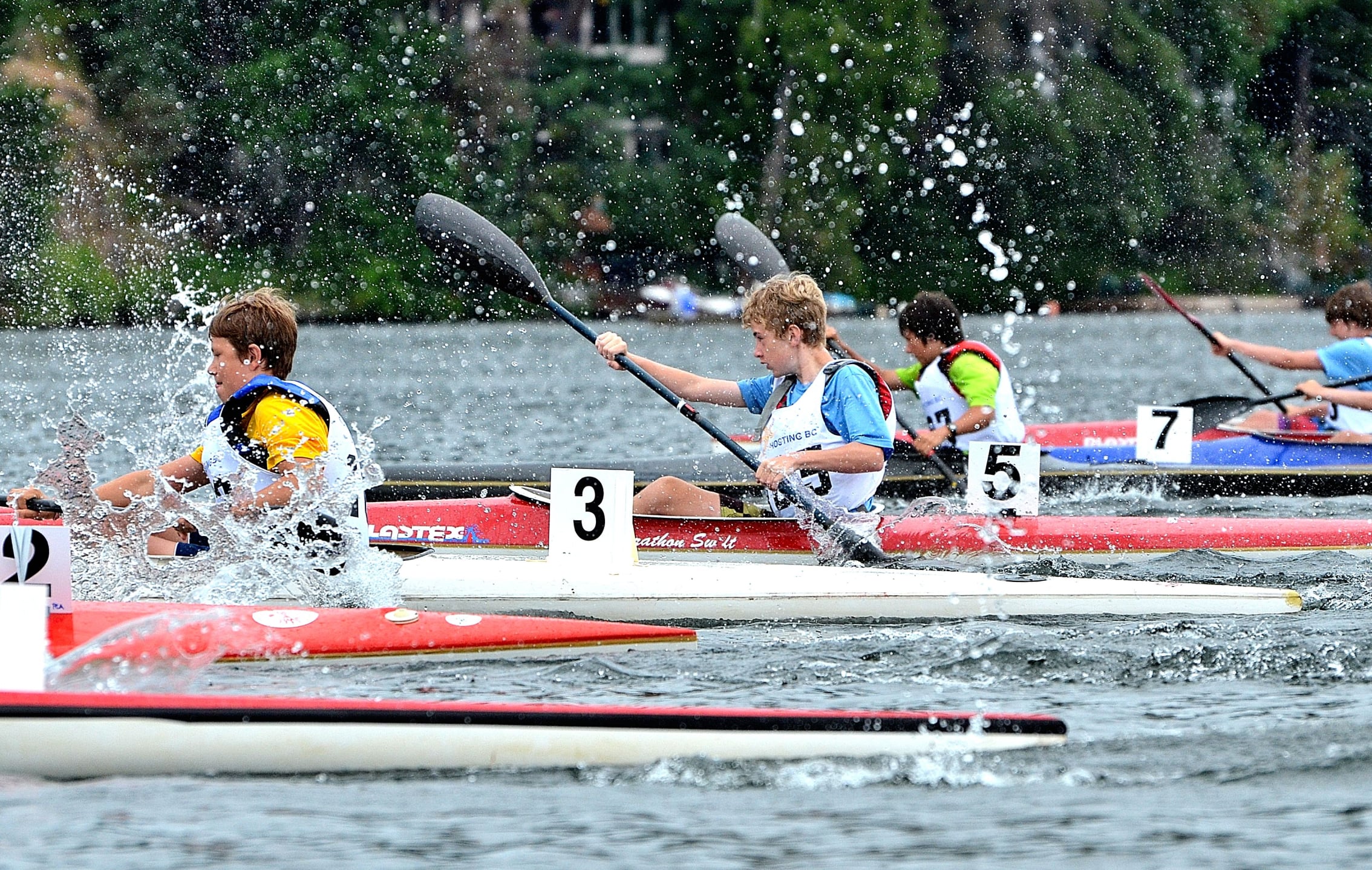 People Kayaking in a race