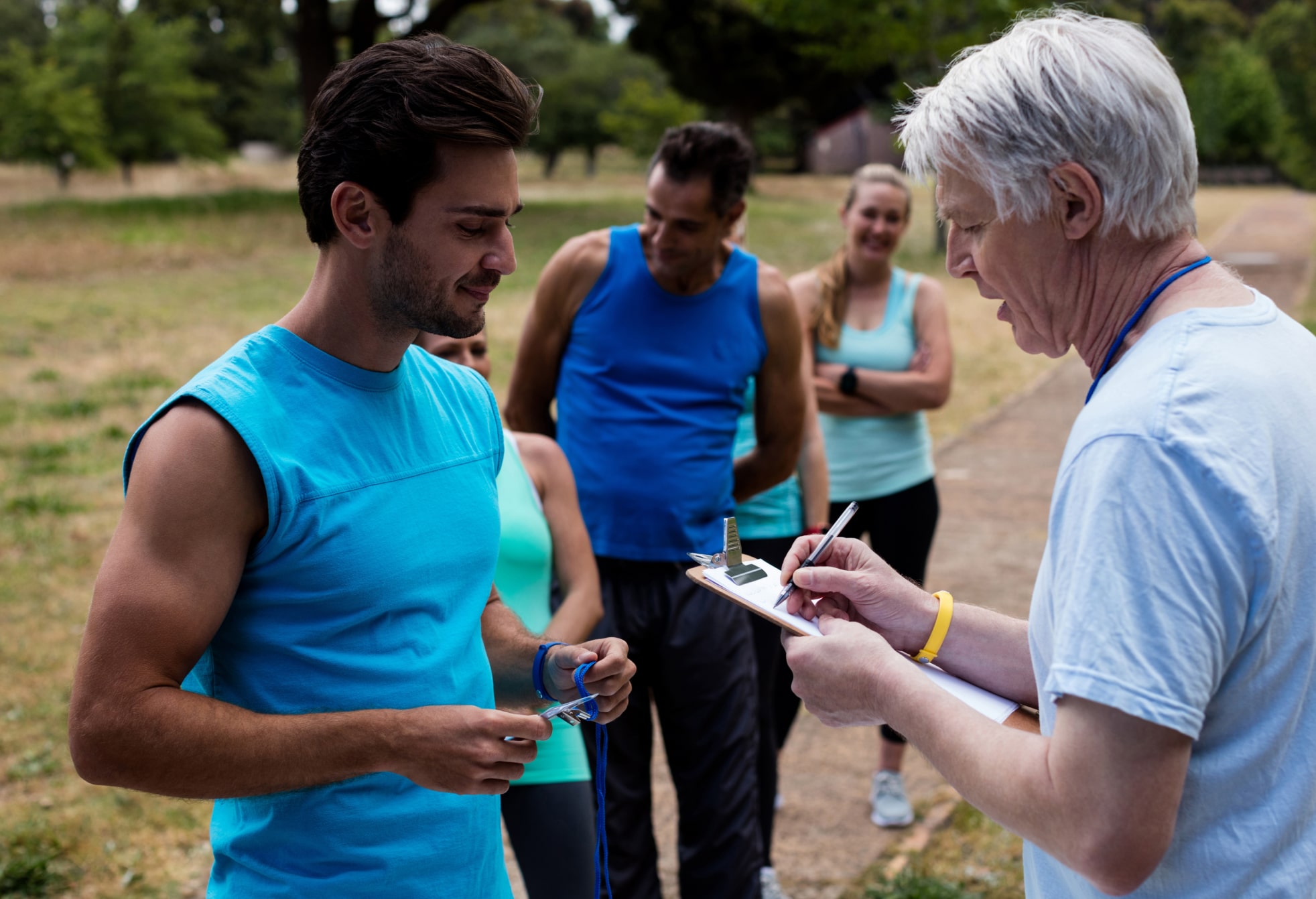 Coach reviewing adult athlete