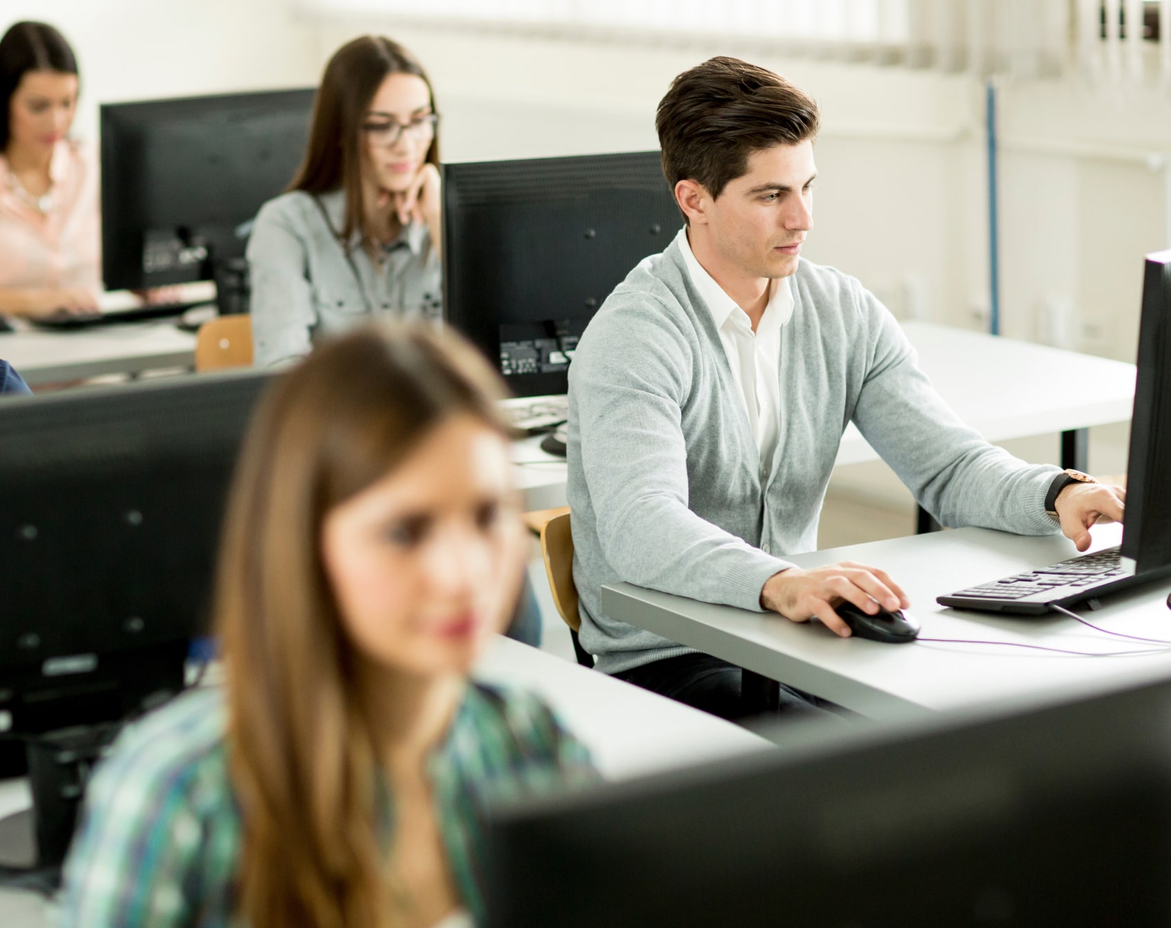 Students in a class taking notes